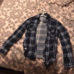Plaid button down long-sleeved shirt.